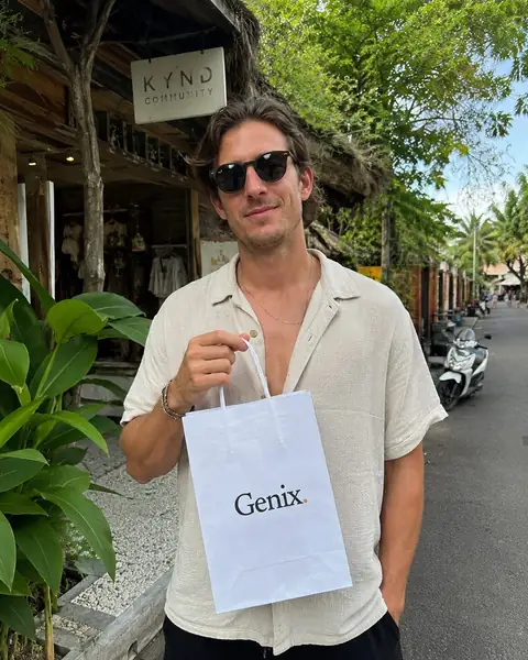 A Genix customer in Bali receiving their sealed delivery parcel